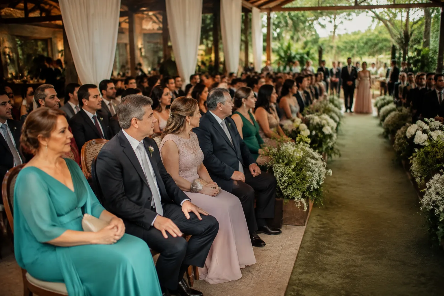 Guests seated for an elegant Brazilian wedding ceremony as the procession begins
